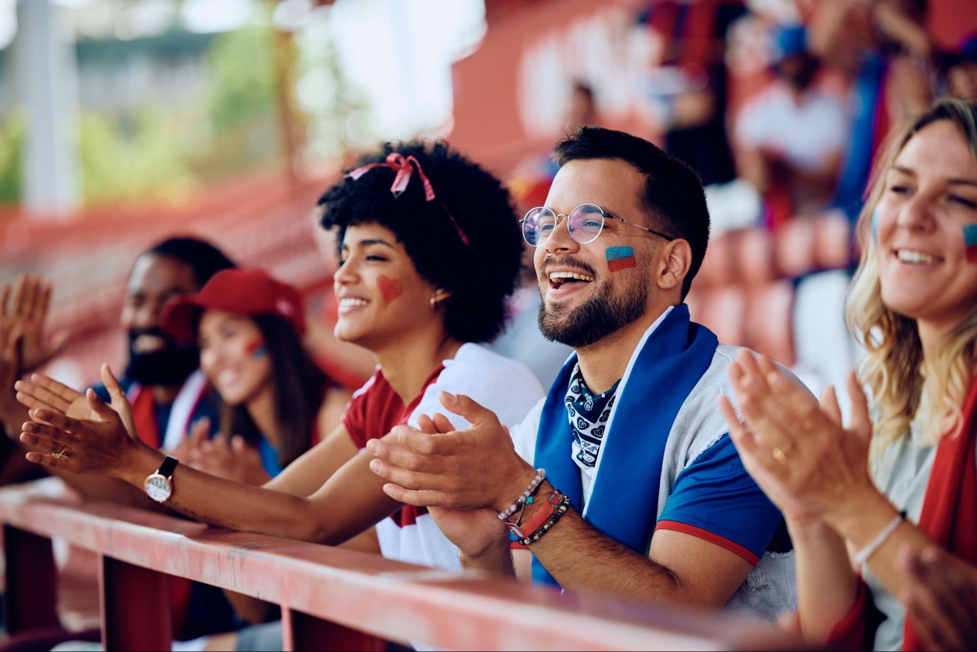 Sports fan sitting in a stadium. 