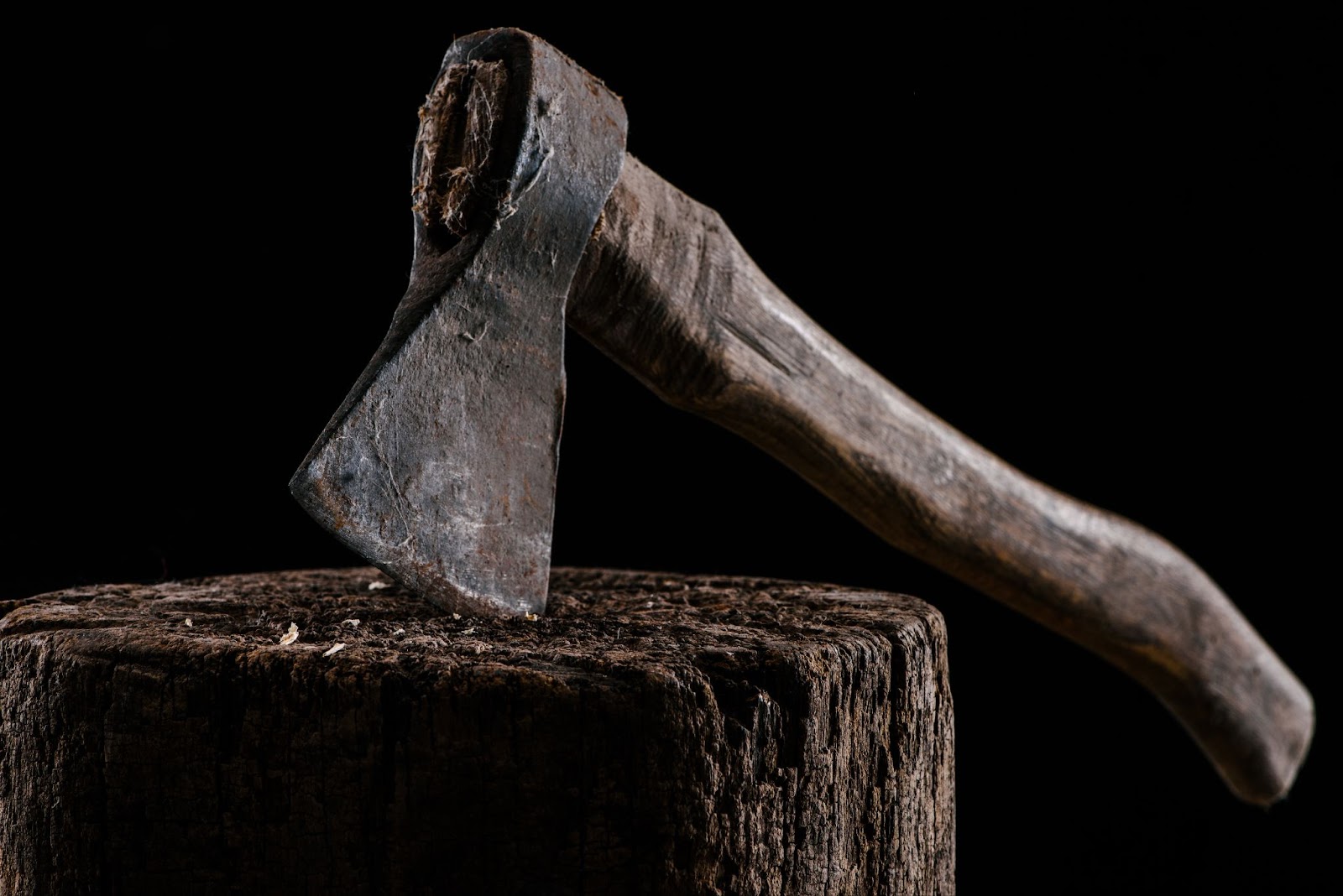 an axe stuck in a log