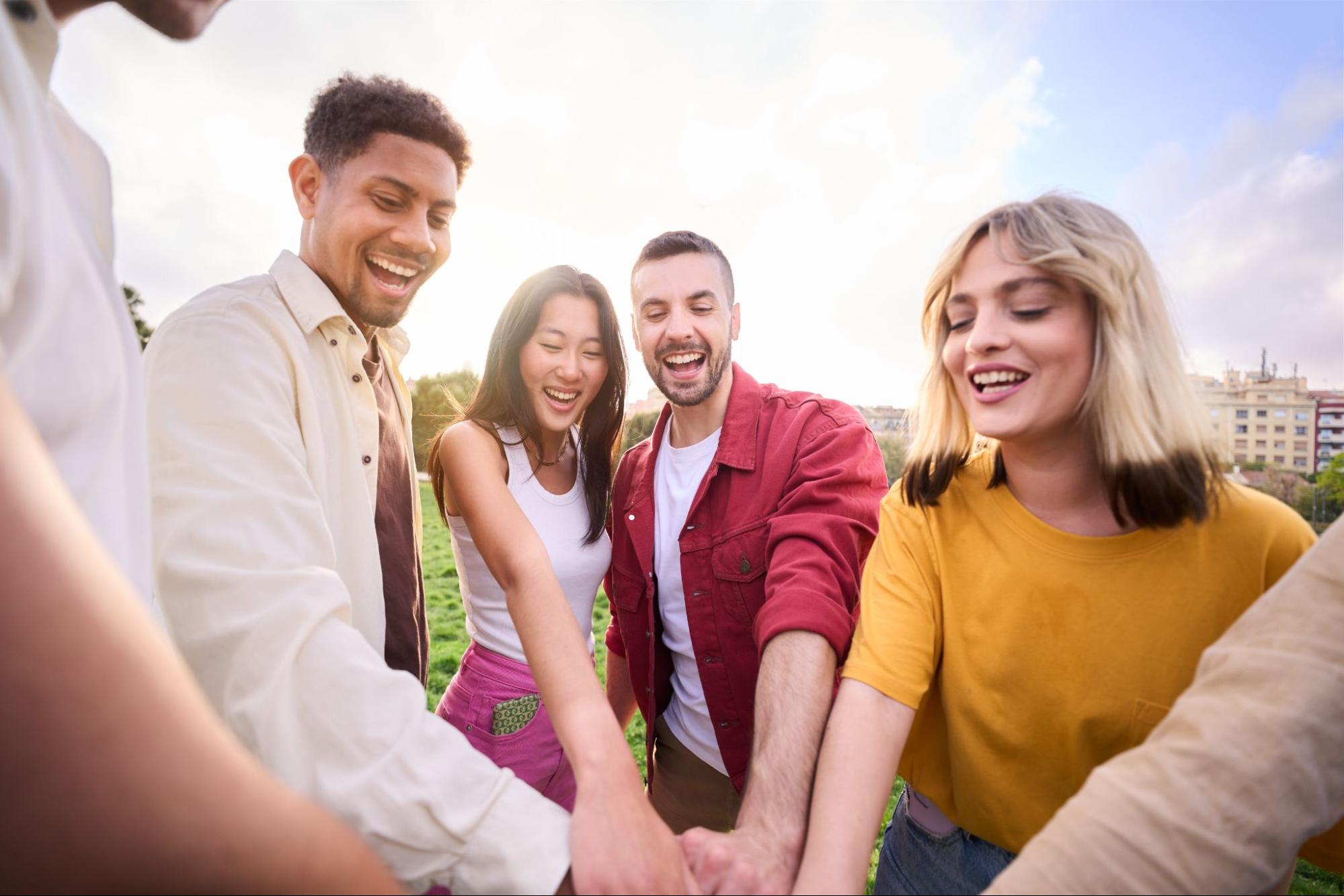 Group of smiling friends outdoors.