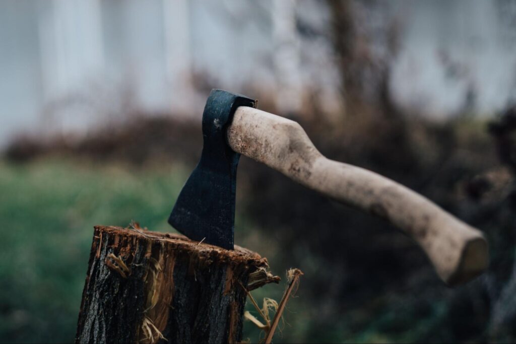 Axe in a piece of wood.